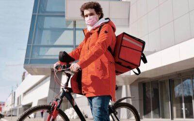 man delivering food on bicycle