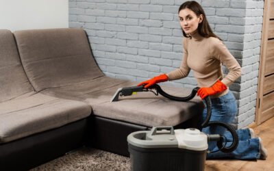 woman vacuuming sofa