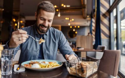 man eating at restaurant